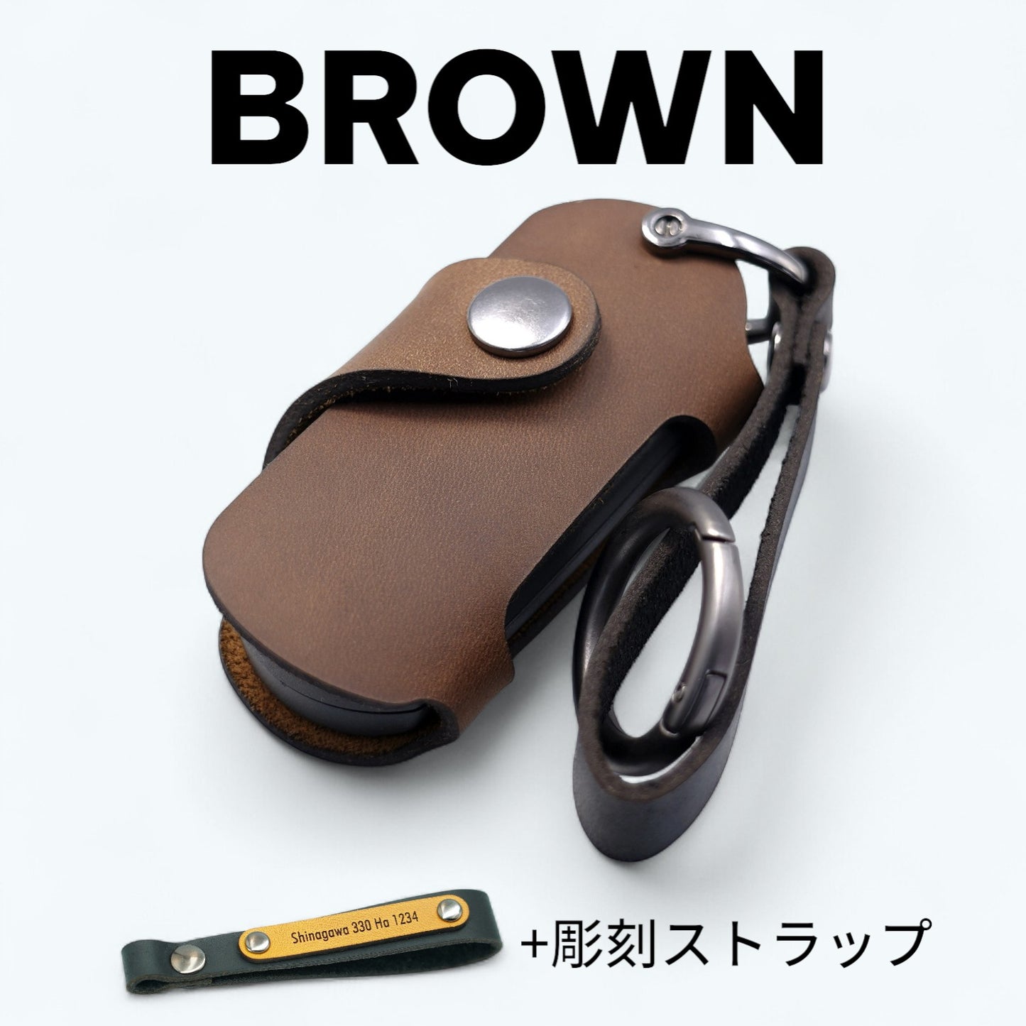 CX-5・ロードスター・アクセラ対応のブラウンキーケース。彫刻ストラップ付きで高級感ある印象。